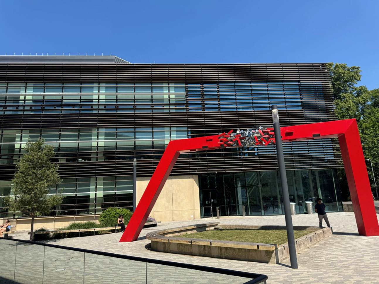 A building with a red pole
AI-generated content may be incorrect.